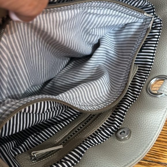 Taupe color leather tote.  Lots of pockets inside and out. - Picture 6 of 12